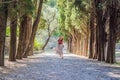 Woman tourist walking together in Montenegro. Panoramic summer landscape of the beautiful green Royal park Milocer on Royalty Free Stock Photo