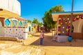 Woman tourist walks through the famous Nubian village