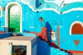 Woman tourist walks through the famous Nubian village