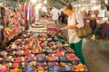 A woman tourists shopping for souvenirs on the night market in Mae Hong Son, Thailand