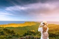 Woman tourists take photos of the crater ilchulbong,Jeju island South Korea