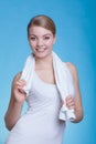 Woman with a towel around her shoulders smiling