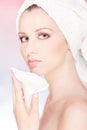 Woman with towel gently holding flower Royalty Free Stock Photo