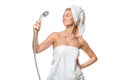 Woman in towel singing using shower head Royalty Free Stock Photo