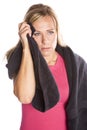 Woman with towel wiping face Royalty Free Stock Photo