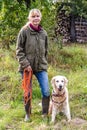 Woman with towline and Golden Retriever