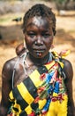BOYA TRIBE, SOUTH SUDAN - MARCH 10, 2020: Woman in traditional colorful clothes and accessories with ritual piercing and scar