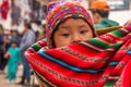 Woman with traditional colourful clothing with her baby , in Chinchero, Peru Royalty Free Stock Photo