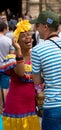 Woman in Traditional Costume Engages a Tourist in Havana, Cuba Royalty Free Stock Photo