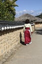 Woman in a traditional Korean costume in the street Andong Hahoe Folk Village in Andong, South Korea Royalty Free Stock Photo