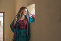 a woman in traditional Omani dress in a countryside of UAE