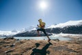 Woman trail runner cross country running in winter mountains Royalty Free Stock Photo