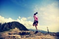 Woman trail runner running on beautiful mountain peak Royalty Free Stock Photo