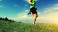 Woman trail runner running on beautiful mountain peak Royalty Free Stock Photo