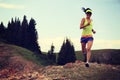 woman trail runner running on beautiful mountain peak Royalty Free Stock Photo