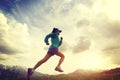 woman trail runner running on beautiful mountain peak Royalty Free Stock Photo