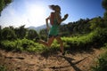 Woman trail runner running in morning forest Royalty Free Stock Photo