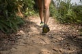 Woman trail runner running on rocky trail