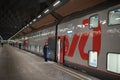 A woman train conductor standing on the platform Royalty Free Stock Photo