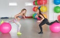 Woman trainer in fitness club. Individual training. Fitness and health concept. Healthy body. Young woman goes in for sports.