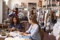Woman training apprentice at a clothes manufacturing studio Royalty Free Stock Photo
