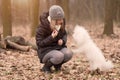 Woman training her dog in park Royalty Free Stock Photo