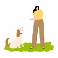 Woman training her dog and showing gesture to sit outdoor Royalty Free Stock Photo