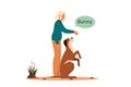 Woman training her pet dog. Happy puppy having command lesson. Royalty Free Stock Photo