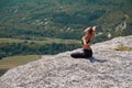 Woman training on high mountain. Contemplation, sport or Yoga time concept. Enjoying virgin nature view. Green hills. Royalty Free Stock Photo
