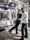 Woman training legs on cable machine at gym Royalty Free Stock Photo