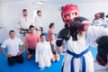 Woman training new taekwondo holds Royalty Free Stock Photo