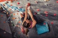 Woman training on practice climbing wall indoor Royalty Free Stock Photo