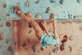 Woman training on practice climbing wall Royalty Free Stock Photo