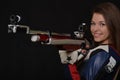 Woman training sport shooting with air rifle gun