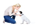 Woman, training and studio with dog or jack russell for silence, learning and care by white background. Girl, animal or