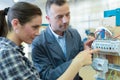 Woman training to learn how to measure electrical current Royalty Free Stock Photo