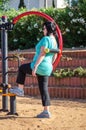 Woman training on a waist back massage machine