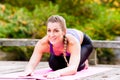 Woman training yoga outdoor in autumn Royalty Free Stock Photo