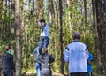 A woman trains to walk on a tight rope with insurance