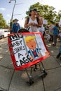 Woman Transports Anti Trump Sign In Baby Stroller At Rally