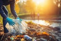 Woman with trash bag picking up plastic bottle waste recycle. Generate Ai