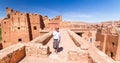 Woman on travel at Ait Benhaddou kasbah, Ouarzazate, Morocco.
