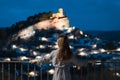 Woman in travel, Asian woman in blue dress looking at the old city of MontefrÃ­o at night in Granada, Spain Royalty Free Stock Photo