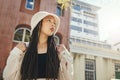 Woman, travel and gen z fashion in city with thinking and freedom idea from urban adventure in New York. Female teenager