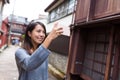 Woman travel in Kanazawa and taking photo by mobile phone Royalty Free Stock Photo