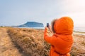 Woman travel at Seongsan Ilchulbong , Jeju Island , South Korea. Royalty Free Stock Photo