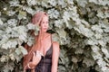 Woman travel winery. Portrait of happy woman holding glass of wine and enjoying in vineyard. Elegant young lady in hat Royalty Free Stock Photo