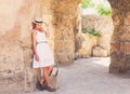 Woman traveler at ancient ruins at Carthage