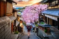 Woman traveler with backpack walking at Historic Higashiyama district in spring, Kyoto in Japan. Royalty Free Stock Photo