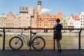 Woman traveler with bicycle